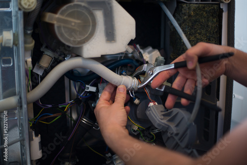 Photos Washing machine repair technician. Washer service