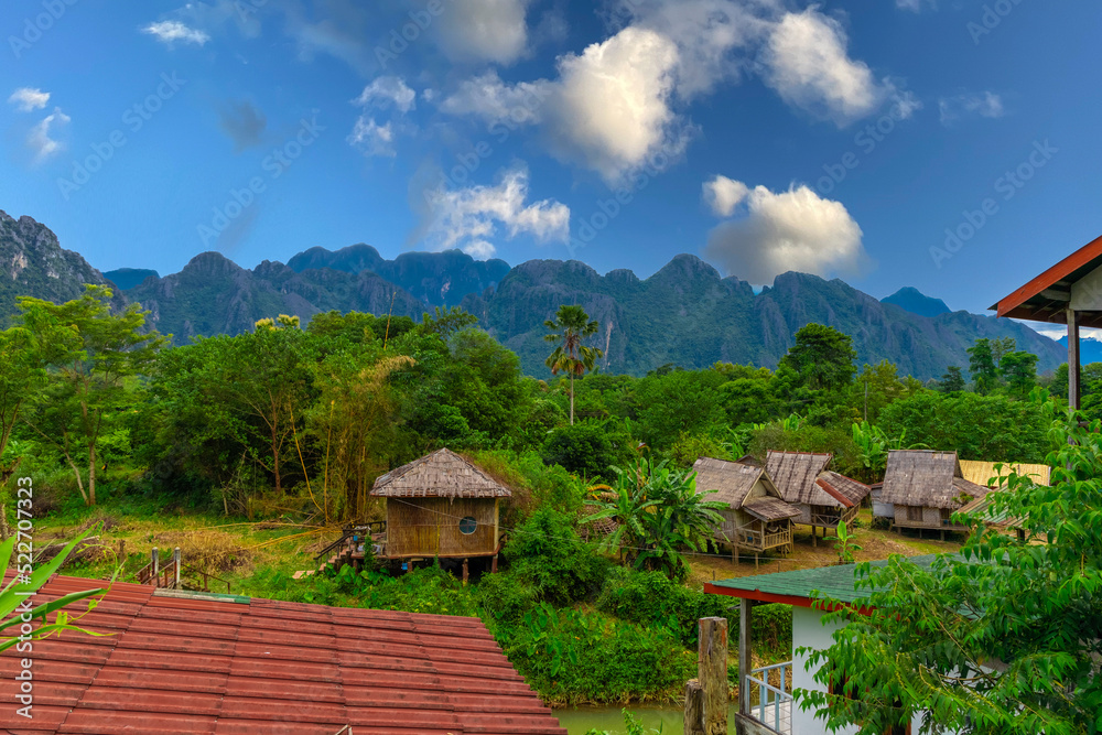 Vang Vieng Laos a beautiful city on the river with huge rising mountains and slow flowing river. 