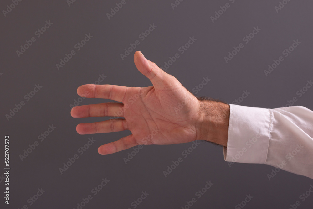 hands creating meanings on a gray background