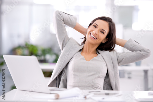 Manager with laptop feeling done, finished or complete with corporate office task, project or innovation. Portrait of leader or boss feeling relieved, accomplished or successful with arms behind head