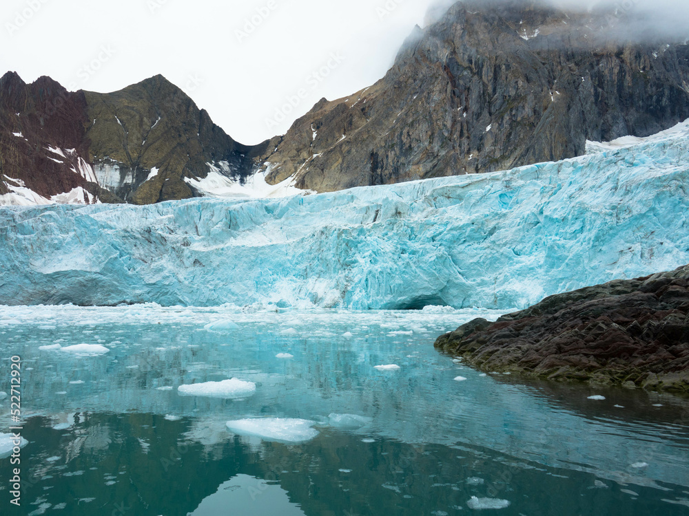 Samarinbreen ended in a calving front at Samarinvagan, a bay on the south side of the Hornsundfjord. Concept for climate change, global warming, north pole, cold nature. Svalbard, Norway Samarinbreen ended in a calving front at Samarinvagan, a bay on the south side of the Hornsundfjord. Concept for climate change, global warming, north pole, cold nature. Svalbard, Norway