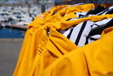 View of traditional yellow raincoats with striped blue and white lining in Brittany, France