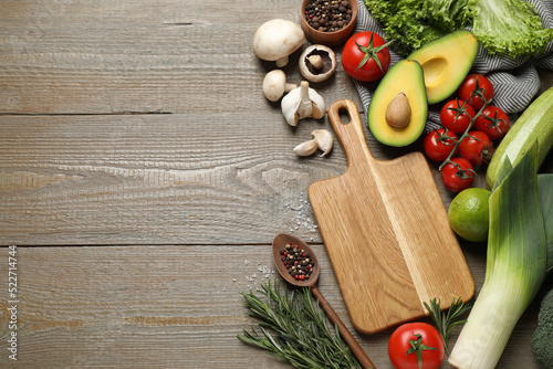 Fototapeta Naklejka Na Ścianę i Meble -  Flat lay composition with fresh products on wooden table, space for text. Healthy cooking