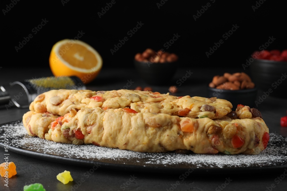 Unbaked Stollen with candied fruits and raisins on grey table, closeup Unbaked Stollen with candied fruits and raisins on grey table, closeup