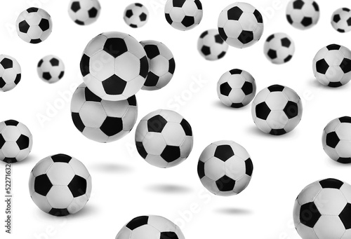 Falling new soccer balls on white background