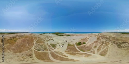 Beach and Paoay sand dune. Sand dunes near to the sea. Monoscopic image. Paoay Sand Dunes, Ilocos Norte, Philippines. photo