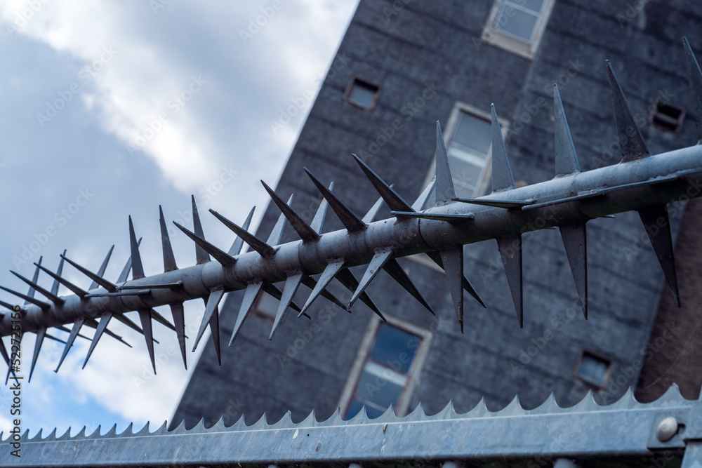 Element of industrial galvanized steel fence and spiked which increases the safety of the place