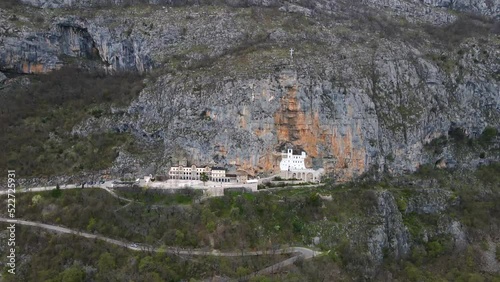 The unique monastery in the rock. the Monastery of Ostrog dedicated to Saint Basil of Ostrog. 4K video round shot. photo