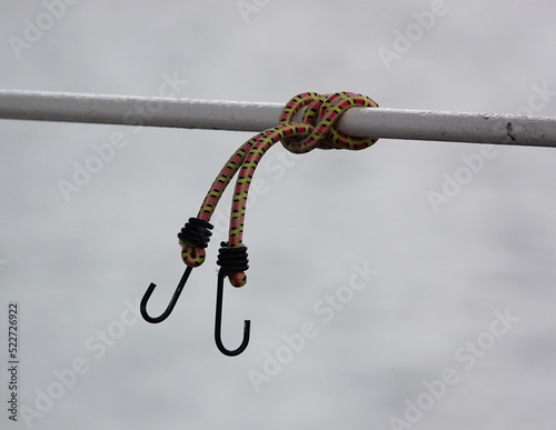 Принти на полотні knot on a bungee rope with hooks on a boat