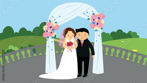 The bride and groom at the wedding ceremony under the wedding arch