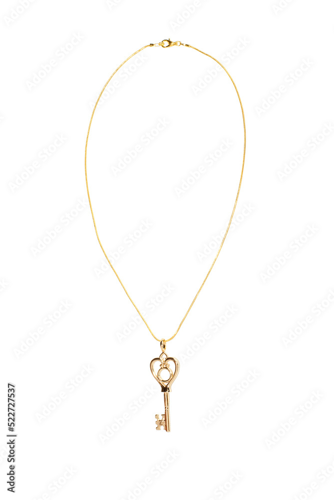 Jewelry pendant in the form of a key on a gold chain on a white isolated background Jewelry pendant in the form of a key on a gold chain on a white isolated background