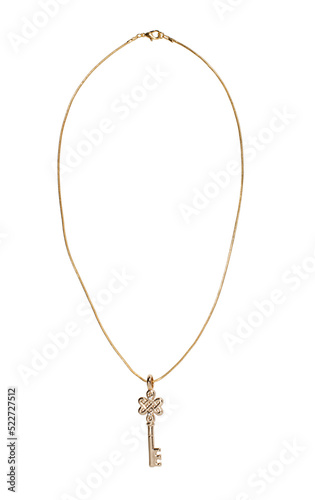 Jewelry pendant in the form of a key on a gold chain on a transparent isolated background