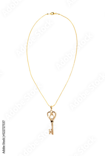 Jewelry pendant in the form of a key on a gold chain on a white isolated background
