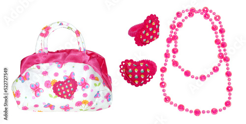 Baby bag, hair bands and beads on a white isolated background. Children's set for girls with butterflies and flowers