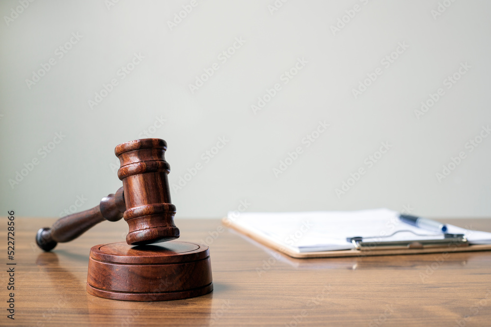  Judges gavel on wooden desk.