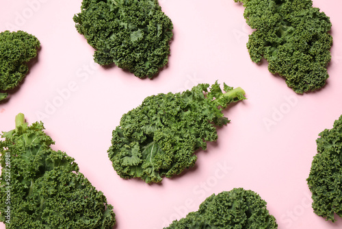Fresh kale leaves on pink background  flat lay
