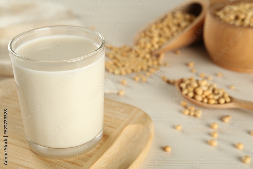 Fresh soy milk and beans on table, closeup. Space for text Fresh soy milk and beans on table, closeup. Space for text