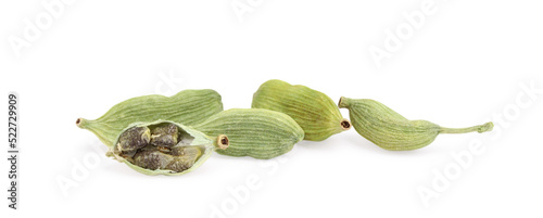 Pile of dry green cardamom pods isolated on white © New Africa