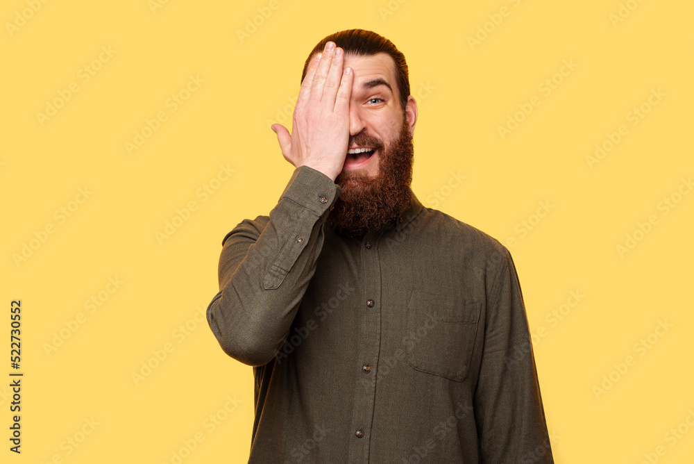 A photo of a man being amazed while he is looking at the camera A photo of a man being amazed while he is looking at the camera