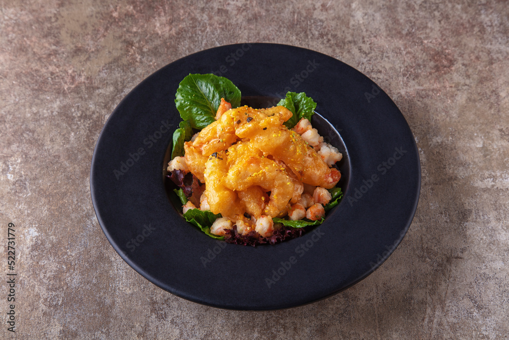 Fried shrimps with crayfish meat and salad Fried shrimps with crayfish meat and salad