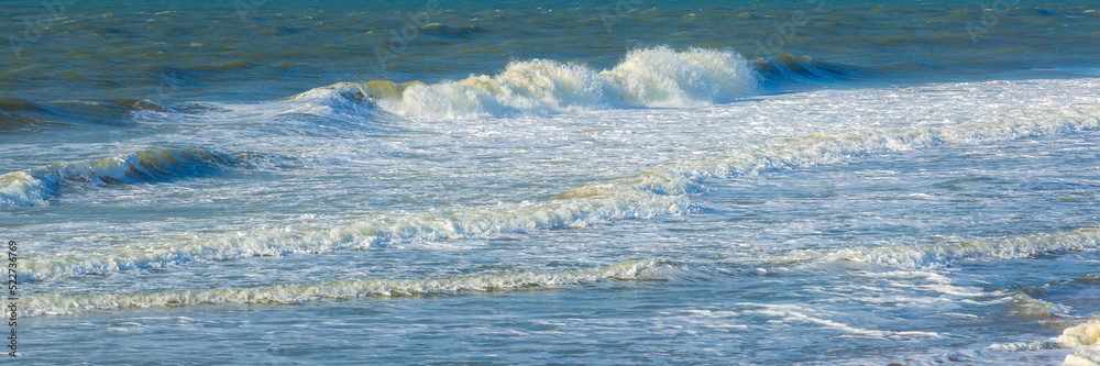 Fototapeta premium Beautiful panorama of splashing blue wave curl