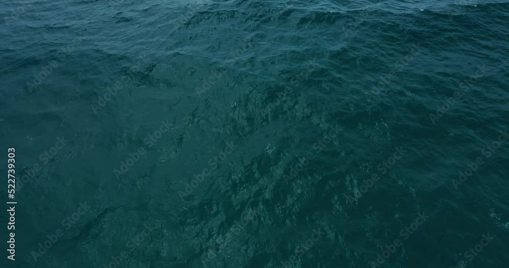 Aerial view of blue ocean sea wave texture as background Aerial view top-down of blue water surface. Professional video high quality 4K ProRes HQ 4:2:2 Aerial view of blue ocean sea wave texture as background Aerial view top-down of blue water surface. Professional video high quality 4K ProRes HQ 4:2:2