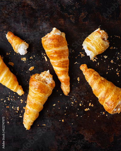 Puff pastry horns filled with Italian meringue, Schaumrollen o Cream Horns photo