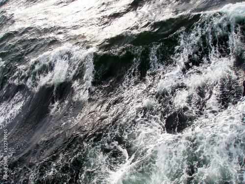 Dark ocean surface and rough wave image.