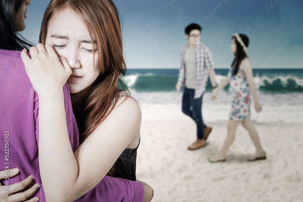 Sad girl look at her boyfriend walking with affair Sad girl look at her boyfriend walking with affair