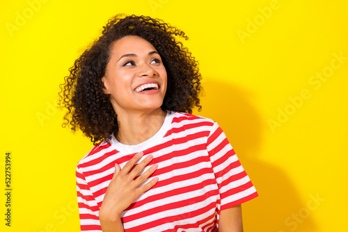 Closeup photo of young funny woman laughing looking empty space what happened isolated on yellow color background © deagreez