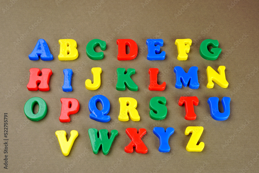 Obraz premium Alphabet on color background. School and education concept. Empty space for text and design