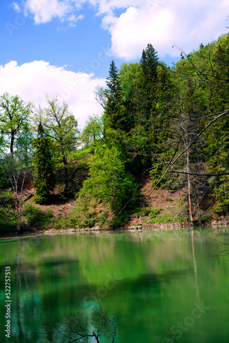 A beautiful blue big lake. Milky-blue water. Blue sky with beautiful clouds. park. a river in the forest. landscape 