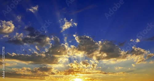 the sun's rays break through clouds