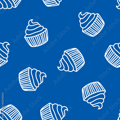 Blue seamless pattern with hand drawn cupcakes