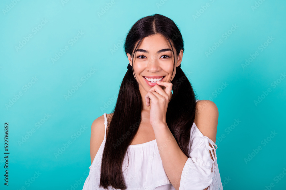 Photo of thoughtful lovely girl dressed off shoulders blouse smiling finger mouth isolated teal color background Photo of thoughtful lovely girl dressed off shoulders blouse smiling finger mouth isolated teal color background