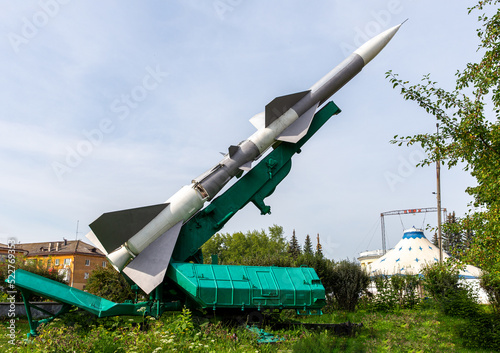 Defense forces weapon. Antiaircraft missles rocket with warhead aimed to the sky photo