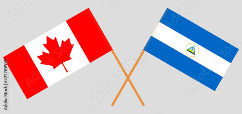 Crossed flags of Canada and Nicaragua. Official colors. Correct proportion
