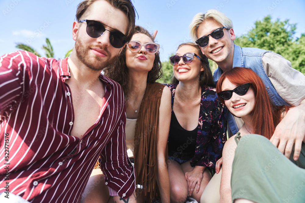 Low angle portrait of caucasian friends having fun on music festival Low angle portrait of caucasian friends having fun on music festival