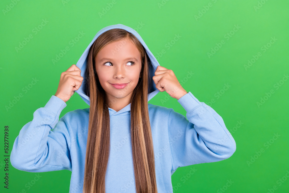 Photo portrait of funny sporty girl model look empty space discount poster wear stylish blue sportswear isolated on green color background Photo portrait of funny sporty girl model look empty space discount poster wear stylish blue sportswear isolated on green color background