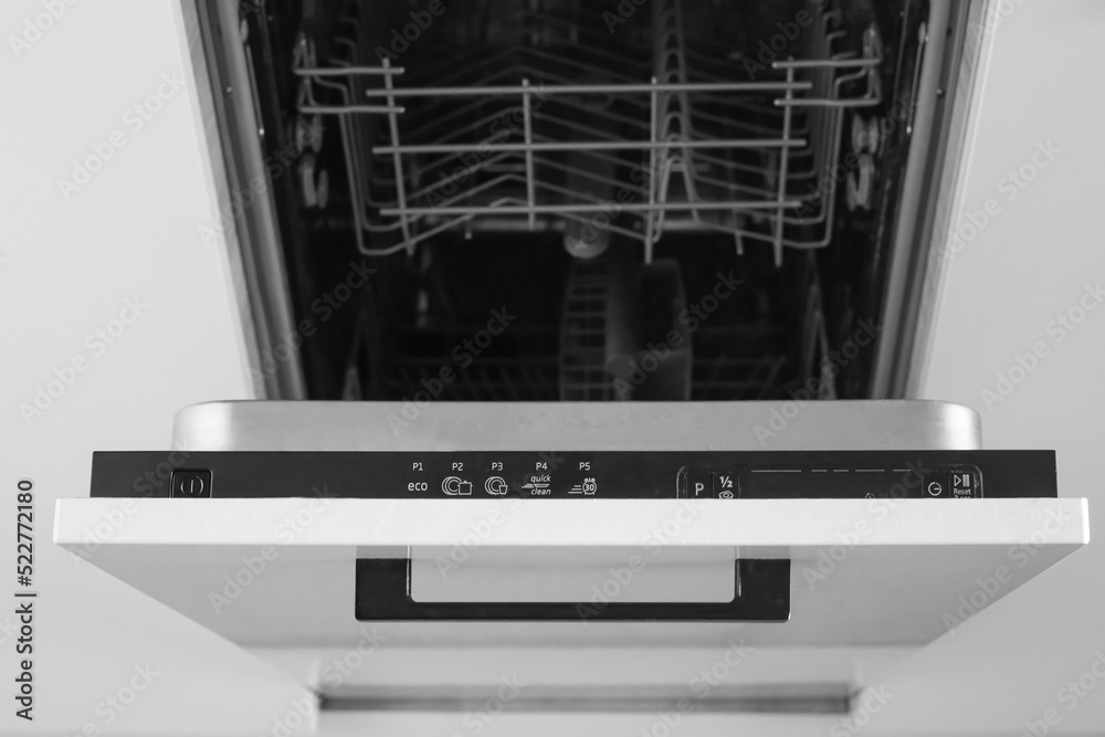 Dishwasher. Loading dishes. Dishwashing capsules. Open dishwasher with clean dishes in the white kitchen. Opening and closing the dishwasher. Dishwasher. Loading dishes. Dishwashing capsules. Open dishwasher with clean dishes in the white kitchen. Opening and closing the dishwasher.