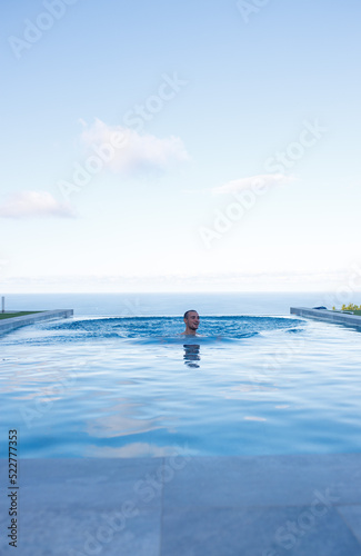 person jumping into the pool