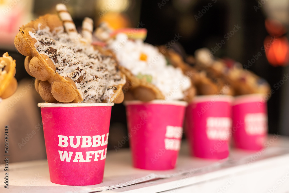 Different types of bubble waffle ice cream to go. Stock Photo Adobe Stock