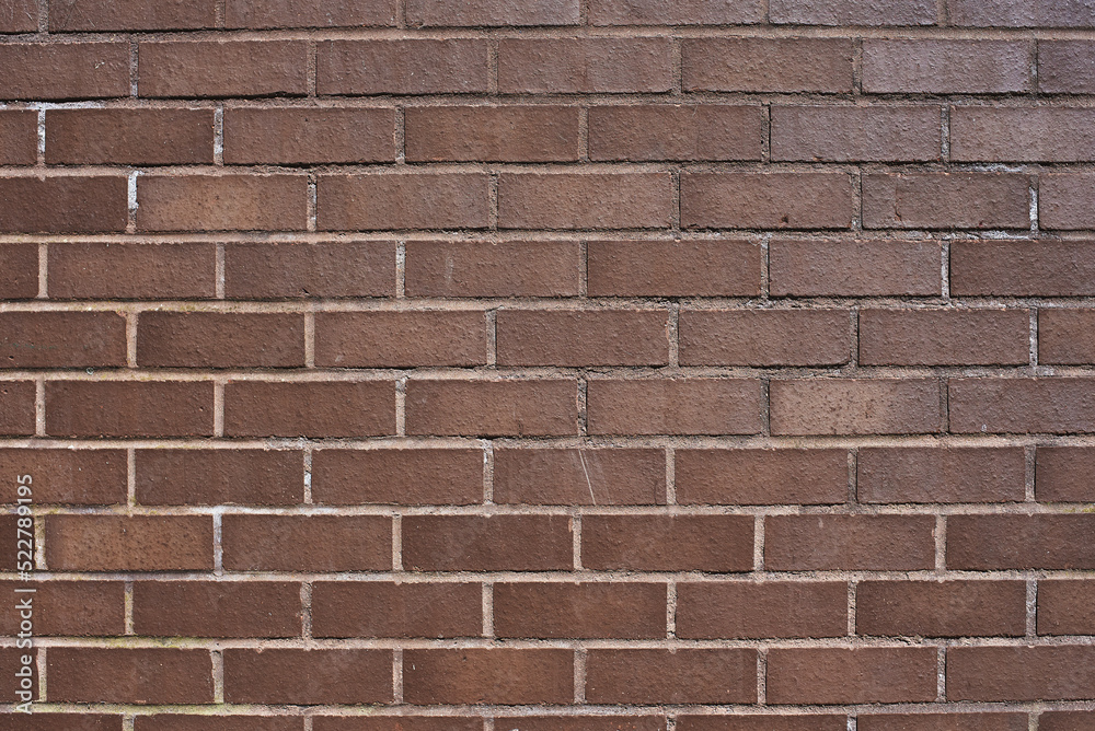 The texture of a neat brown stone. Smooth brickwork with brown smooth stone. The texture of the wall of the English house. The texture of a neat brown stone. Smooth brickwork with brown smooth stone. The texture of the wall of the English house.