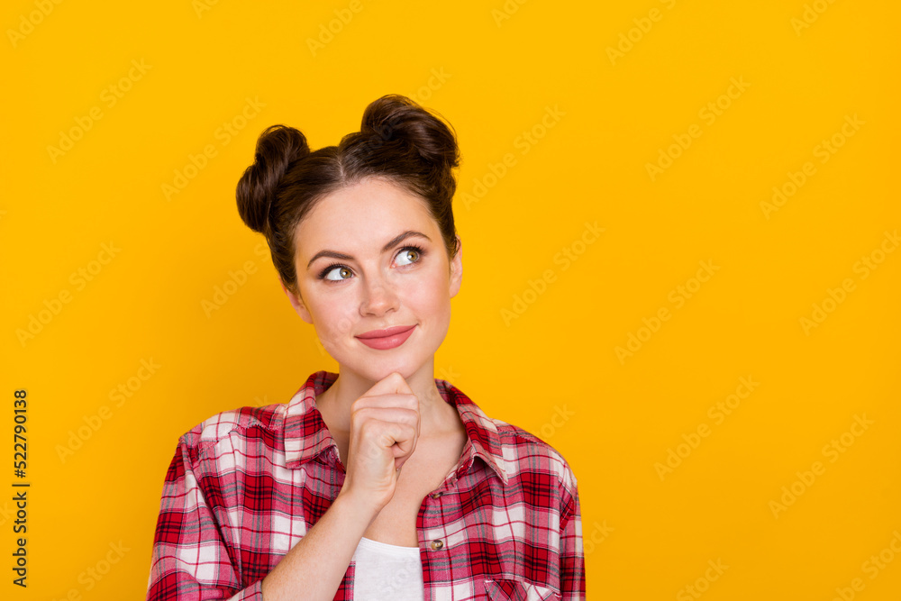Photo of cute minded person arm chin look interested empty space isolated on yellow color background Photo of cute minded person arm chin look interested empty space isolated on yellow color background
