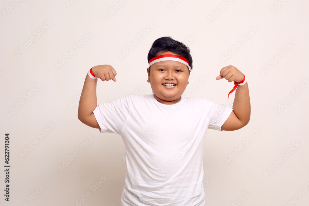 Naklejka premium Indonesian kids celebrate independence day. Isolated on white background