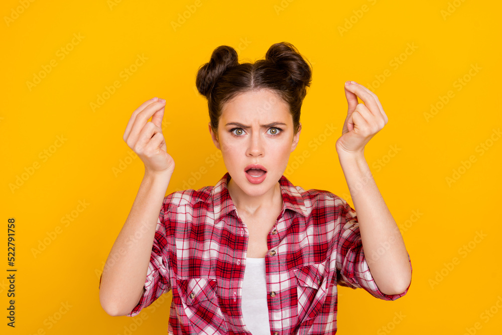Photo of unsatisfied furious girl arms fingers demonstrate italian symbol isolated on yellow color background Photo of unsatisfied furious girl arms fingers demonstrate italian symbol isolated on yellow color background