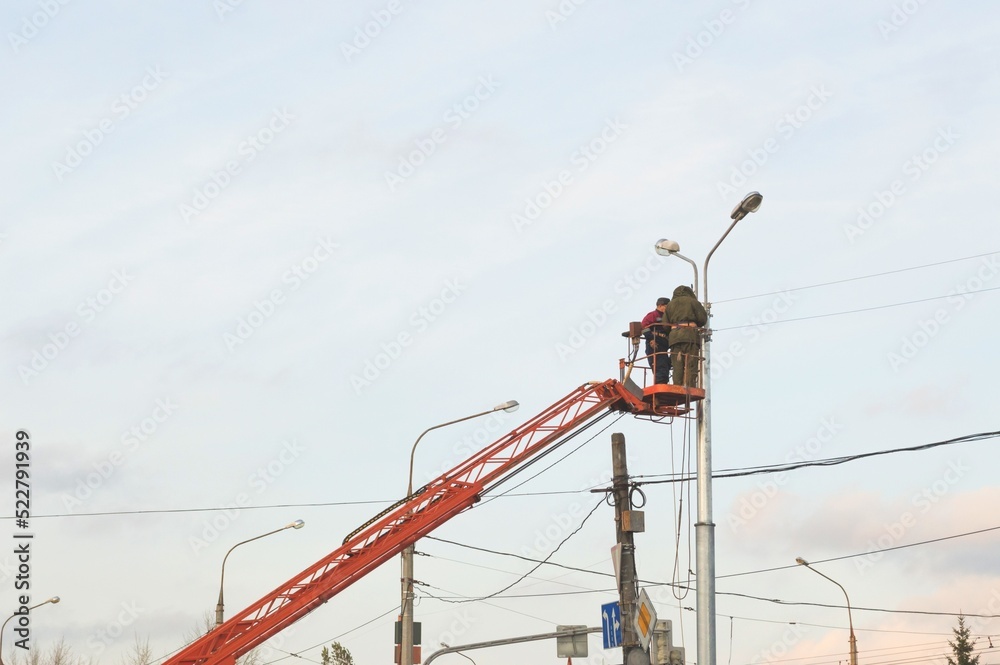 Workers repairing electricity on  special equipment