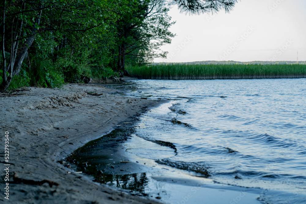 Fototapeta premium Lake Kisezers in the evening with sands and beautiful landscape