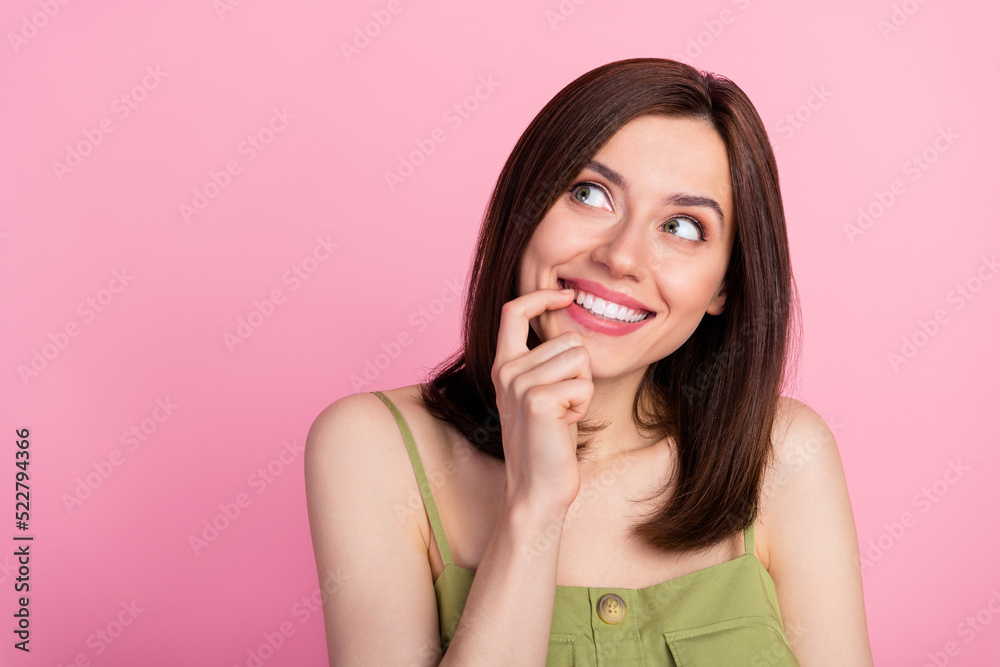 Photo of cute brunette lady finger mouth wear khaki top isolated on pink color background Photo of cute brunette lady finger mouth wear khaki top isolated on pink color background