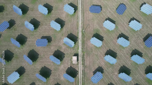 Silicon photovoltaic panels with defective single-axis tilted track system In a small solar power plant. 